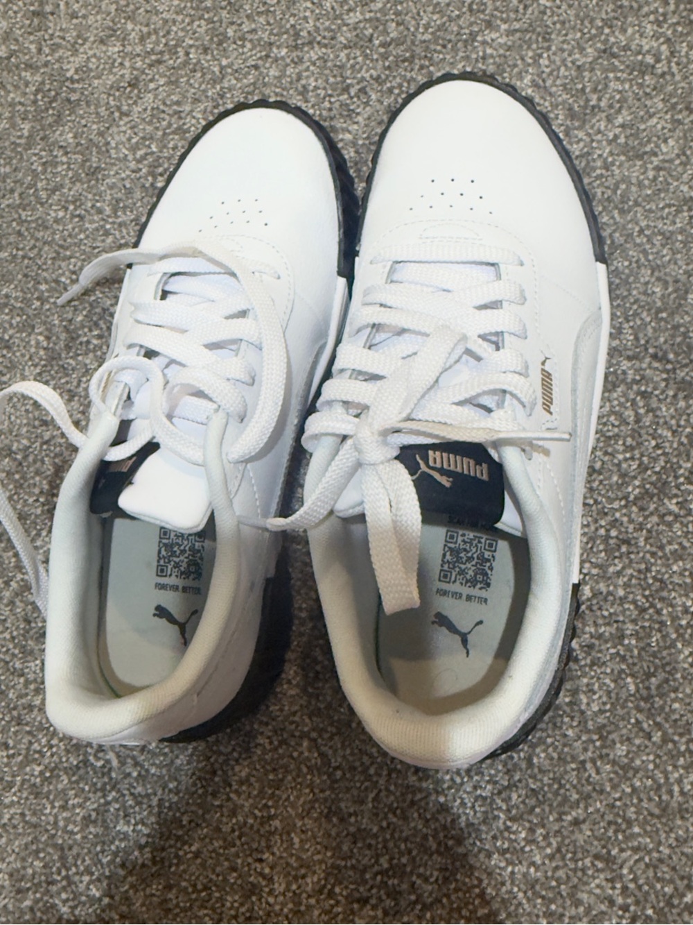 Puma White Sneakers with Black Soles and Accents